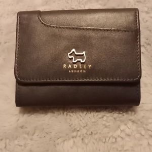 Dark blue leather , tri fold ( but still a smaller wallet ) 4 x 3.5 inches.